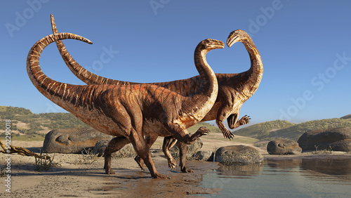 Fototapeta Naklejka Na Ścianę i Meble -  Plateosaurus couple, dinosaurs from the Late Triassic period walking on the beach 