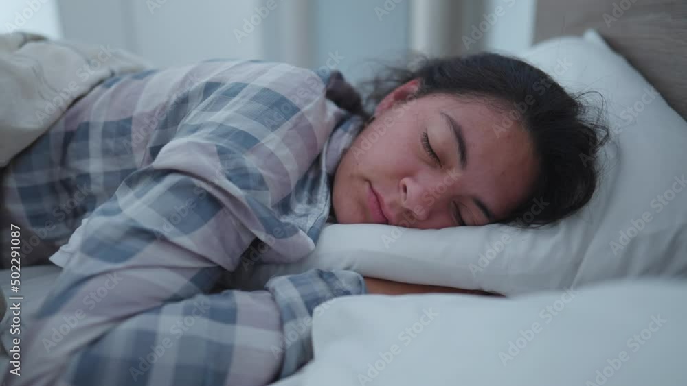 One woman sleeping in the morning One woman sleeping in the morning