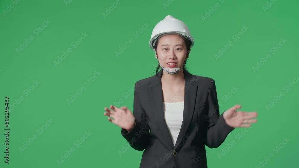Smiling Asian Female Engineer Talking While Walking In The Green Screen Studio
Smiling Asian Female Engineer Talking While Walking In The Green Screen Studio