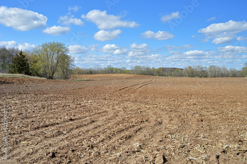 Plowed field in the spring countryside on a sunny day