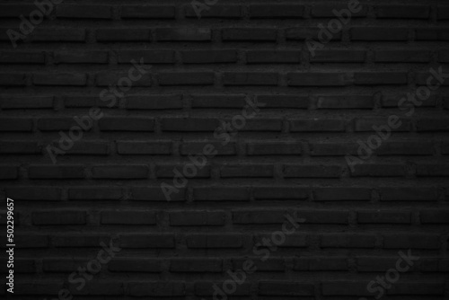 Rough black brick wall texture background.Old rough stone texture background.