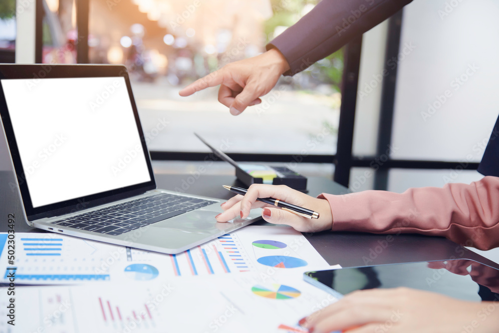 Businesswoman using computer and graph showing successful teamwork. Summary of past income and expenses, business idea Businesswoman using computer and graph showing successful teamwork. Summary of past income and expenses, business idea