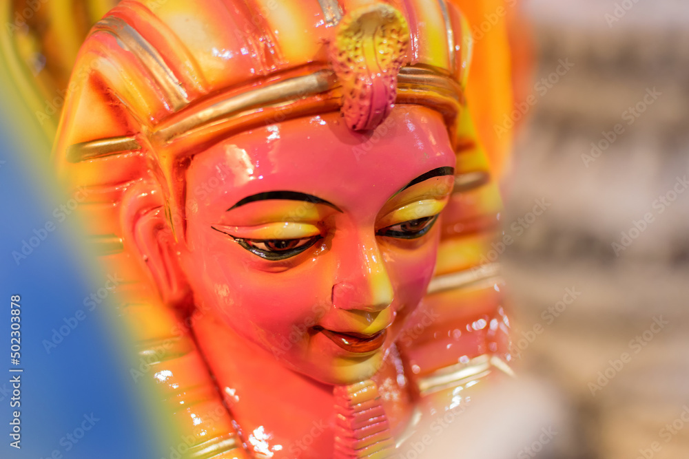 Face of Tutankhamun, Egyptian pharaoh, Colorful doll made of clay, handicrafts on display during the Handicraft Fair in Kolkata , earlier Calcutta, West Bengal, India. Face of Tutankhamun, Egyptian pharaoh, Colorful doll made of clay, handicrafts on display during the Handicraft Fair in Kolkata , earlier Calcutta, West Bengal, India.