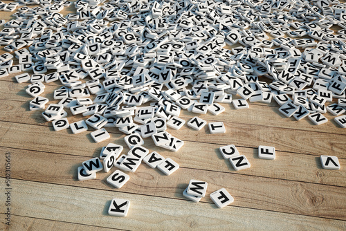 Letter tiles on wooden floor photo