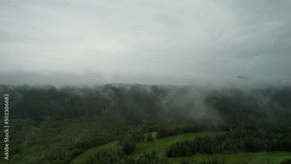 Flying Through Clouds 4K Aerial Above Forest Of The Adirondack Mountains. Flying Through Clouds 4K Aerial Above Forest Of The Adirondack Mountains.