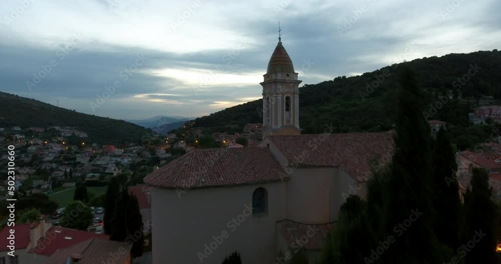 Aerial Forward Shot Of Cross Symbol On Religious Structure In Town During Sunset - Monaco Aerial Forward Shot Of Cross Symbol On Religious Structure In Town During Sunset - Monaco