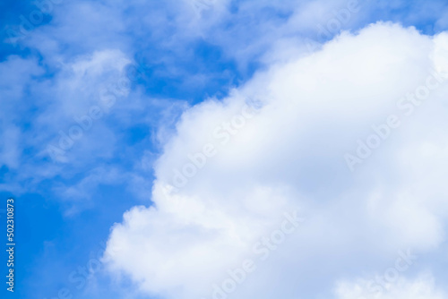 Cumulus clouds. White clouds on a blue background.