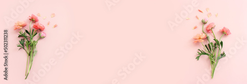 Top view image of pink flowers composition over pastel background © tomertu