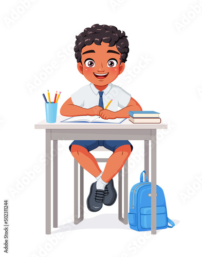 Happy Indian school boy sitting at desk. Cartoon vector illustration.