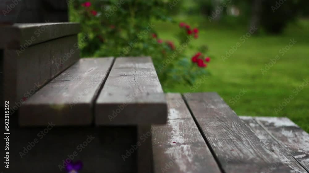 Man walks with brown shoes on wooden steps outside a house. Man walks with brown shoes on wooden steps outside a house.