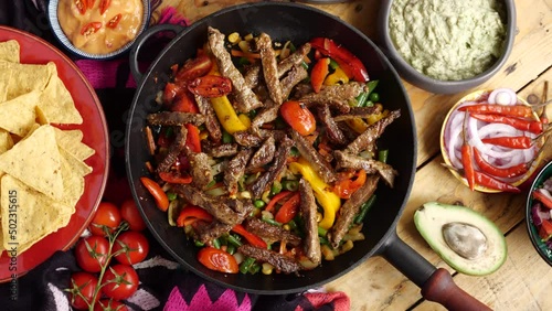 Fajitos fajita fajitas is a popular Mexican dish of meat and vegetables, cut into strips and grilled