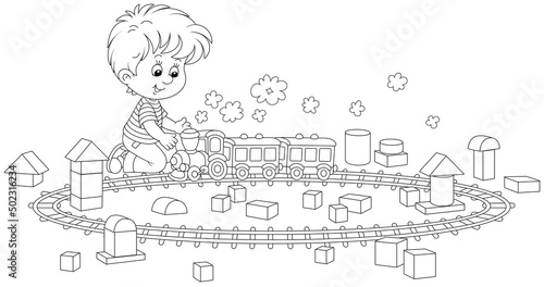 Happy little boy playing with a toy railway train and cubes of different shapes in a playroom, black and white outline vector cartoon illustration for a coloring book