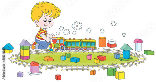 Happy little boy playing with a toy railway train and cubes of different shapes and colors in a playroom, vector cartoon illustration on a white background
