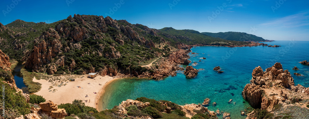 Li Cossi beach, a romantic, sheltered and relaxing cove among the pink cliffs of Costa Paradiso in northern Sardinia.