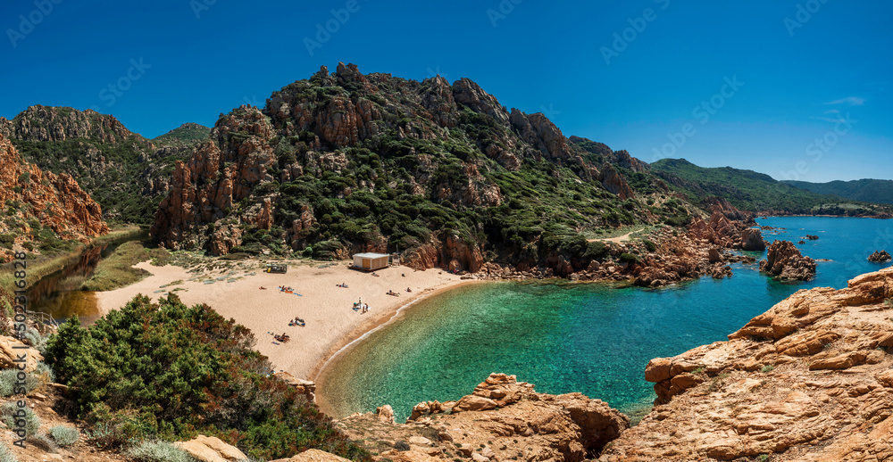 Li Cossi beach, a romantic, sheltered and relaxing cove among the pink cliffs of Costa Paradiso in northern Sardinia.