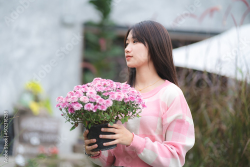 young Asian cute girl weari...
