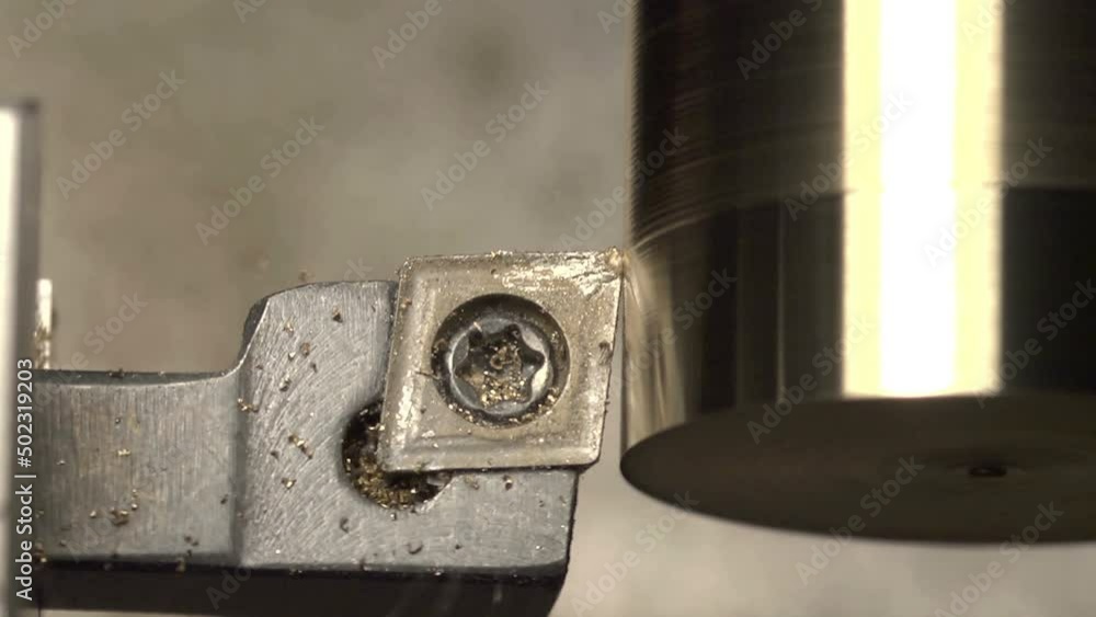 finishing cut to a brass bar in the lathe with a knife tool