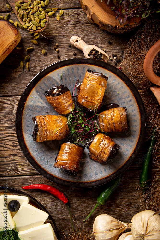 Fototapeta premium Georgian eggplant appetizer badrijani portion on the table