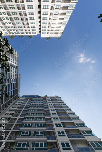 Residential apartment or condo buildings against blue sky