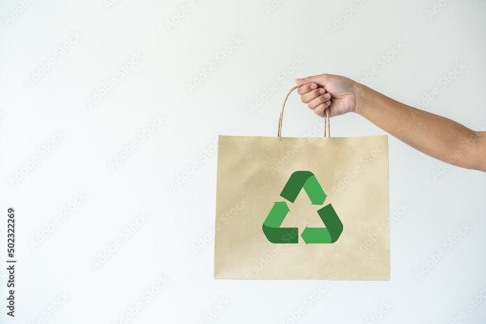 Foto Stock Woman carrying paper bag concept of reuse, recycle the ...