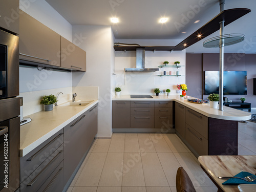 Modern interior of kitchen in luxury studio apartment.