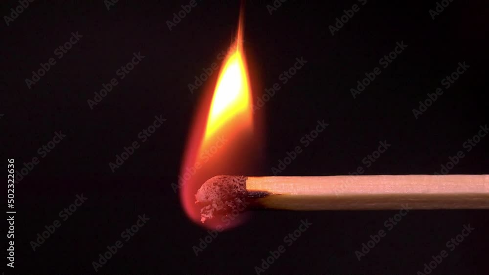 A single match igniting and burning along - Slow motion A single match igniting and burning along - Slow motion