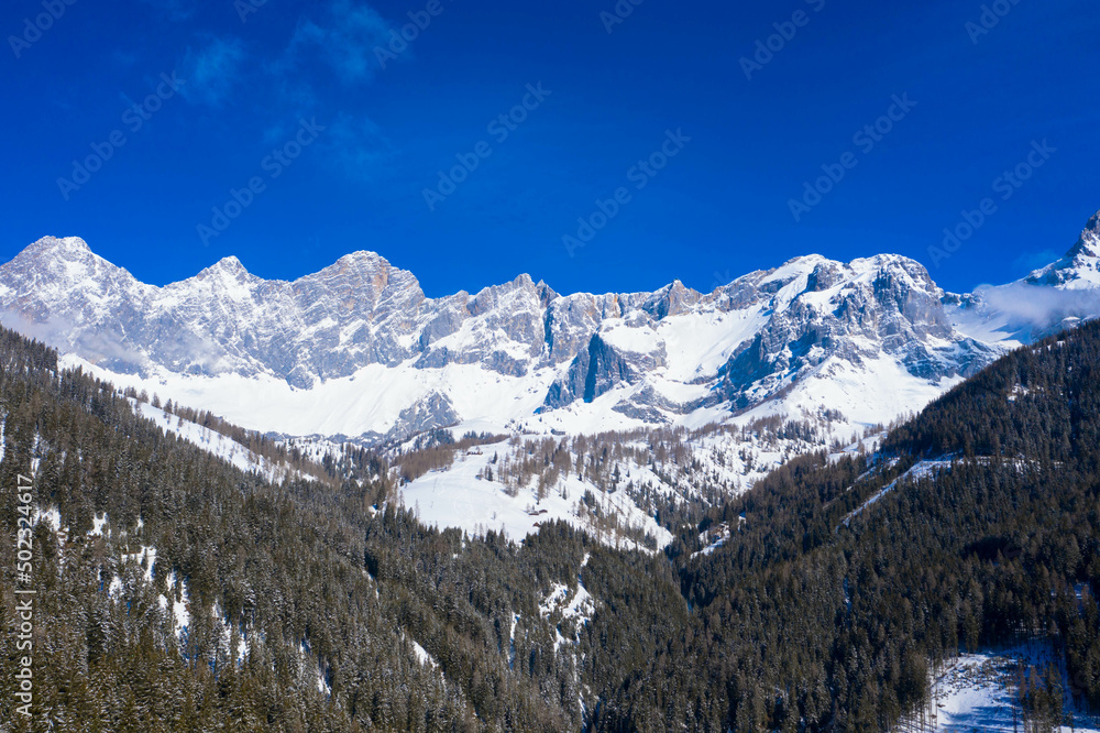 Panorama aerial view from the Dachstein Glacier. The plateau is the best place for skiing, snowboarding and other winter sports, Styria, Austria. Tourism and vacations concept.