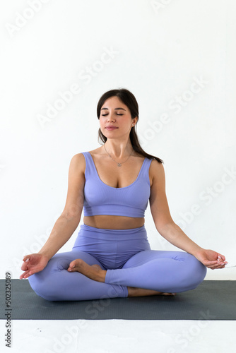 young woman practicing yoga white background, healthy lifestyle and wellbeing concept