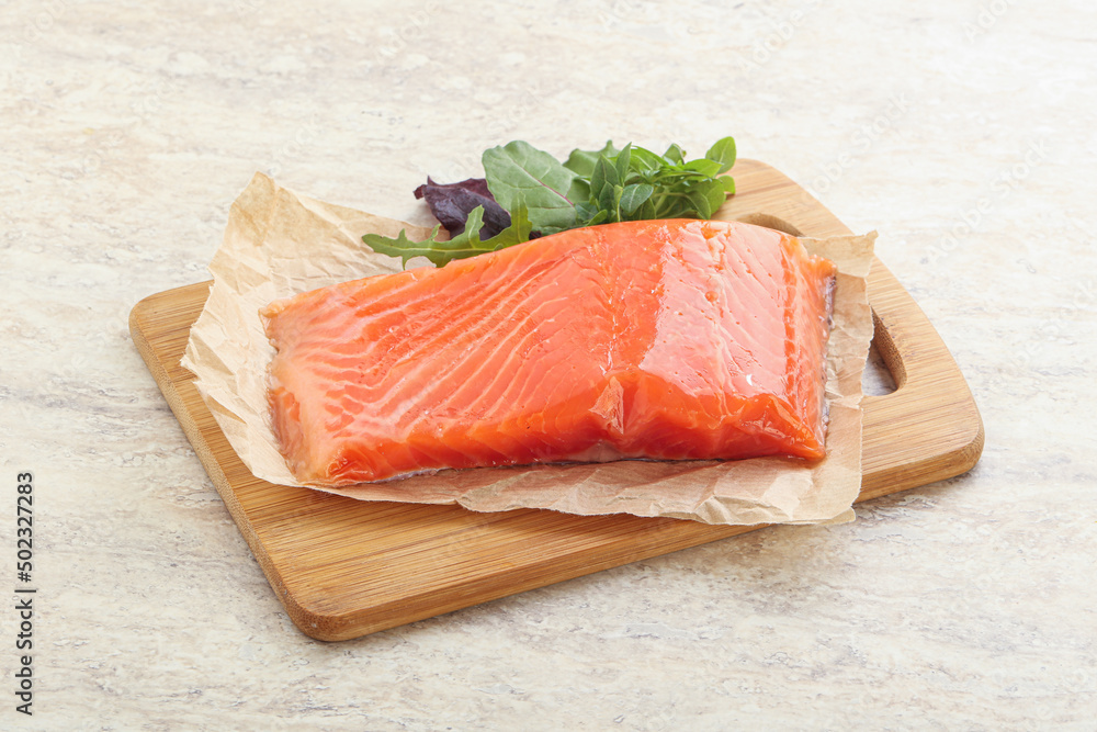 Raw salmon fillet over board Raw salmon fillet over board