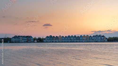 Colorful houses beside the lake at dusk in Houten, Utrecht, Nehterlands