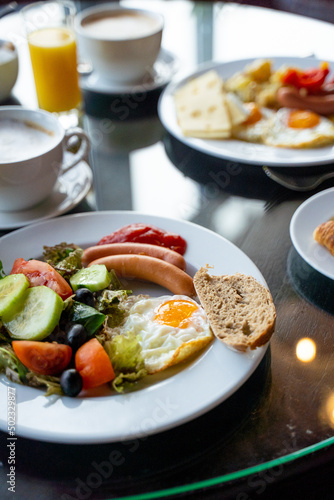 Delicious Breakfast for Two at the Luxury Hotel  Eggs  Sausages  Vegetables  Croissants Coffee  Orange Juice
