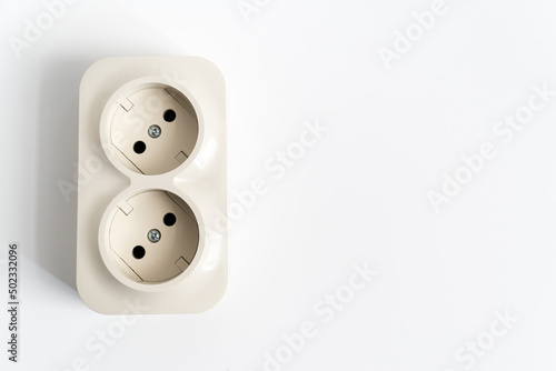 Double socket on a white background. two sockets, united by one monolithic case. The socket has two plug connectors, but is installed in one standard socket. electrical goods store.