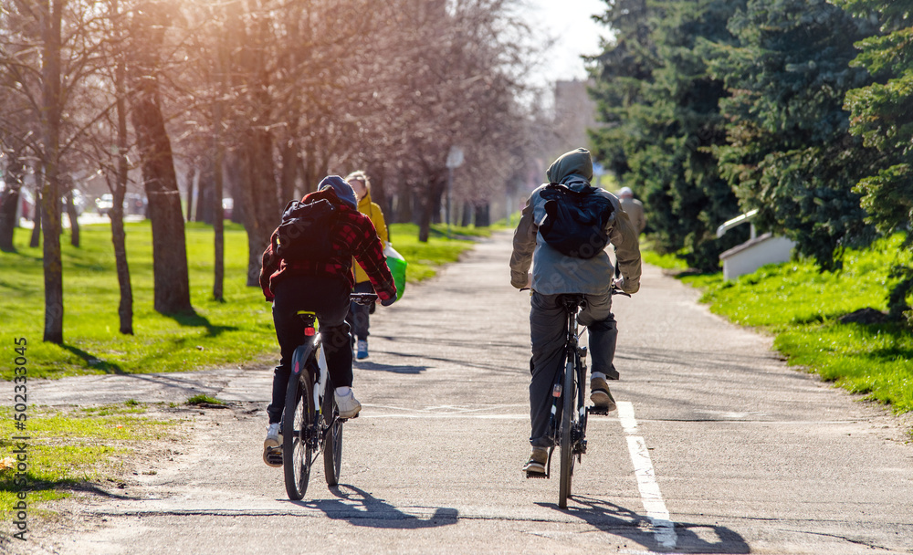 Cyclists ride on the bike path in the city Park
Cyclists ride on the bike path in the city Park