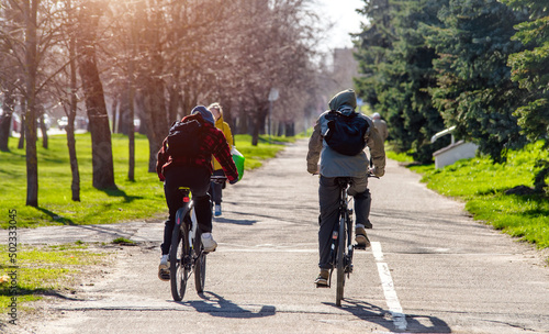 Fototapeta Naklejka Na Ścianę i Meble -  Cyclists ride on the bike path in the city Park
