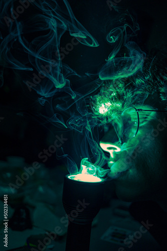 boy smokes up with green torch