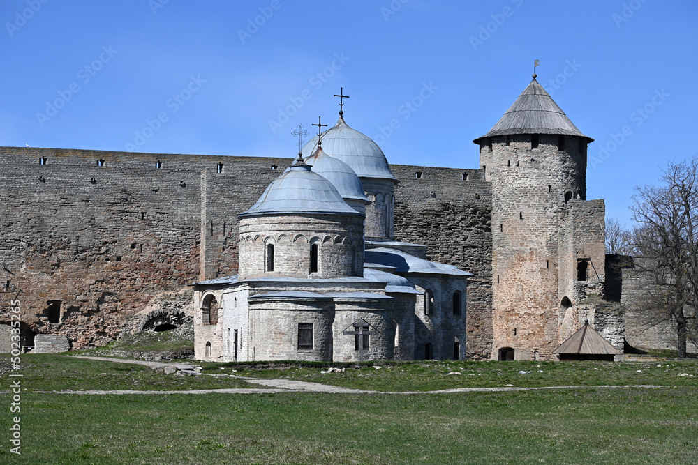 The domes of the cathedral and churches, the fortress wall and the corner tower in the medieval fortress of Ivangorod on the border of Russia and Estonia in the Leningrad region. The domes of the cathedral and churches, the fortress wall and the corner tower in the medieval fortress of Ivangorod on the border of Russia and Estonia in the Leningrad region.