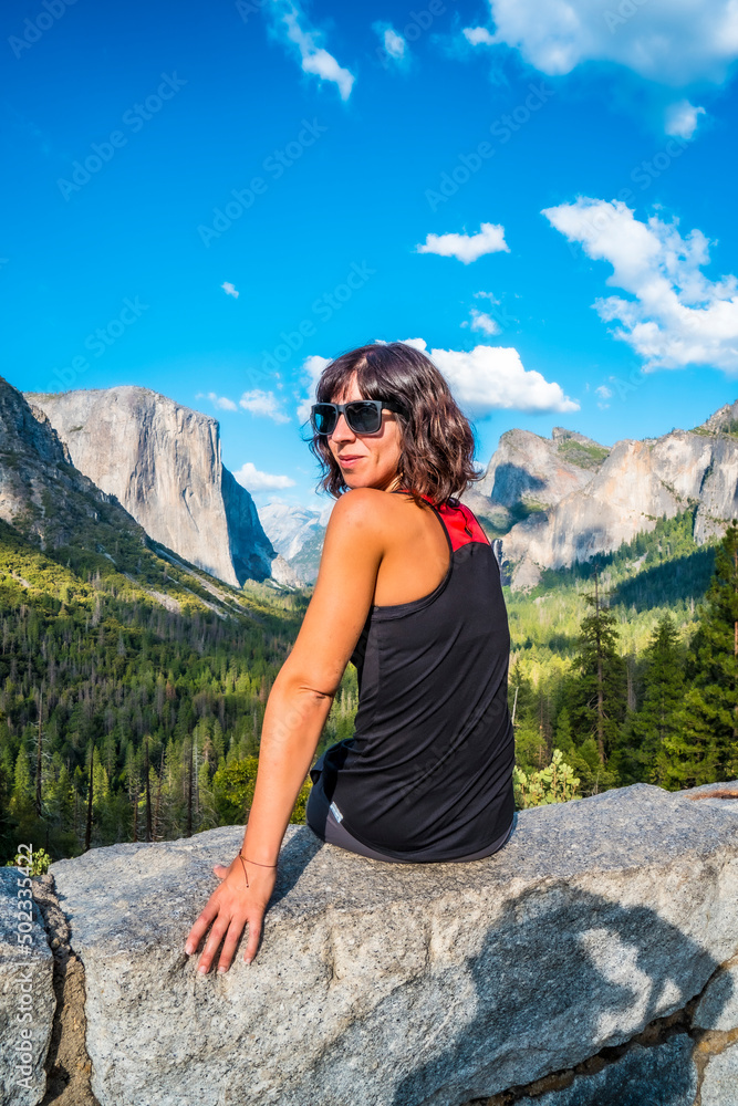 A young woman at the Tunnel View viewpoint, Yosemite National Park. United States