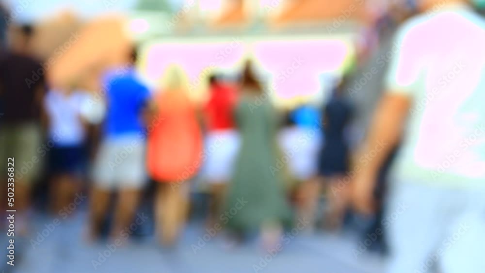 Out of focus crowd, people, town, street. Summer time. In move. Out of focus crowd, people, town, street. Summer time. In move.