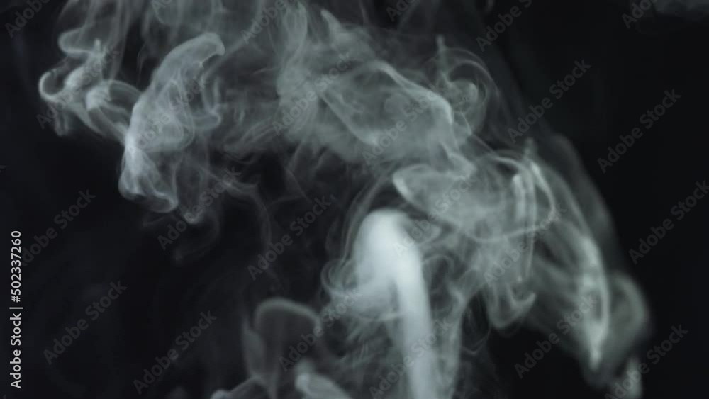 Movement of thick smoke on a black background Movement of thick smoke on a black background