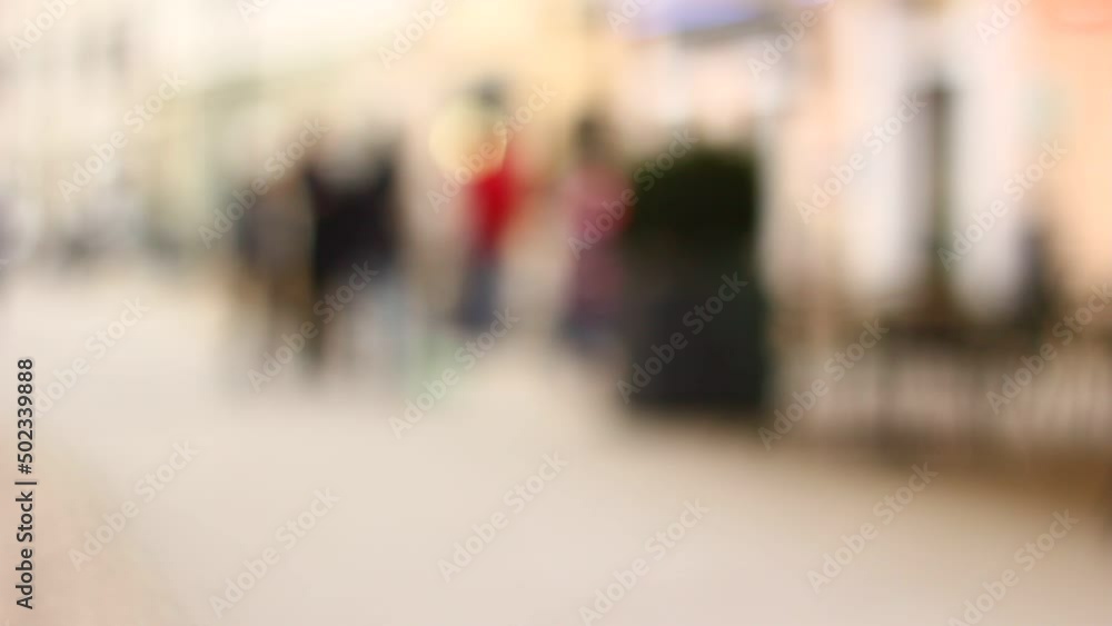 Out of focus, blurred, not recognizable people in town, on streets. Walking. Out of focus, blurred, not recognizable people in town, on streets. Walking.