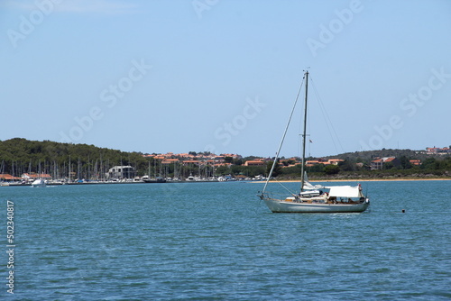 Small boats  vessels near shore. Sea.