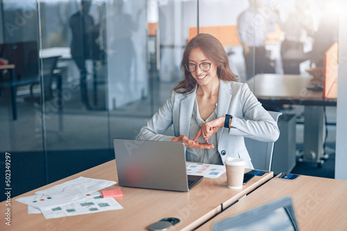 Confident deaf businesswoman communicating in video call at workplace at office. Business concept