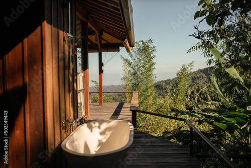 White beautiful open-air bathroom on the terrace overlooking the mountains