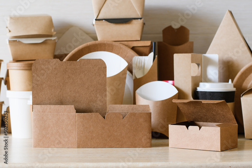 Eco-friendly cardboard boxes and food packaging. An example of a collapsible container made from biodegradable paper. photo