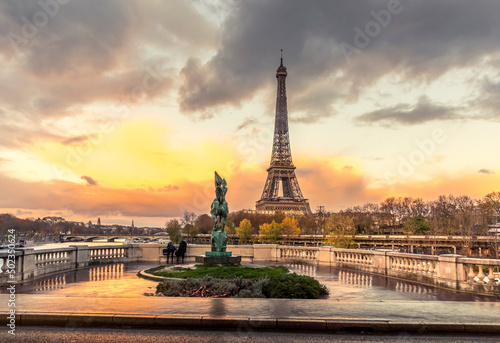 Fototapeta Naklejka Na Ścianę i Meble -  Paris, France - November 19, 2020: Eiffel tower seen from arch of Bir Hakeim bridge in Paris