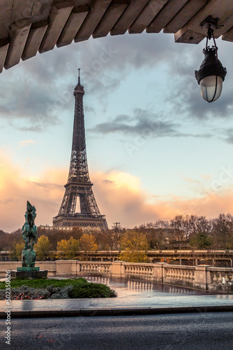 Paris, France - November 19, 2020: Eiffel tower seen from arch of Bir Hakeim bridge in Paris