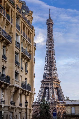 Paris, France - December 11, 2021: Nice view of Eiffel tower with Haussmann building in Paris