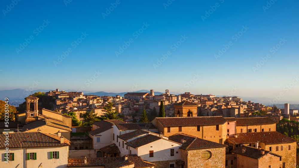 Perugia old skyline at sunset with medieval churches and towers