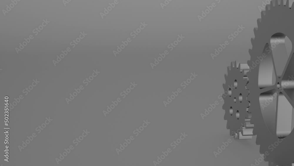 two steel pinions rotating on gray background and gear teeth two steel pinions rotating on gray background and gear teeth