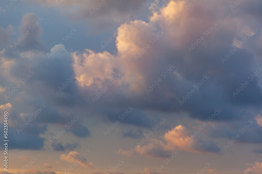 Beautiful blue sky with pink clouds at sunset, natural abstract background and texture. Retro tone